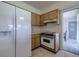 Efficient kitchen setup with modern refrigerator and range at 5004 S Hesperides St, Tampa, FL 33611