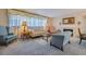 Classic living room featuring carpet floors, a fireplace, and elegant decor for comfortable living at 5004 S Hesperides St, Tampa, FL 33611
