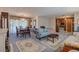 Spacious living room featuring a chandelier-lit dining area and comfortable, patterned furniture at 5004 S Hesperides St, Tampa, FL 33611