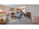 Spacious living room featuring comfortable seating, a fireplace, and carpet flooring at 5004 S Hesperides St, Tampa, FL 33611