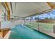 Covered patio with a bar-height countertop and large backyard at 5004 S Hesperides St, Tampa, FL 33611