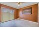 Wood paneled room with access to the backyard through the large window at 5004 S Hesperides St, Tampa, FL 33611