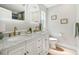 Bathroom boasts marble countertop, dual sinks and stylish fixtures at 521 51St S Ave, St Petersburg, FL 33705