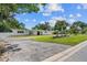 Inviting single-story home with well-maintained landscaping, circular driveway, and a bright white exterior at 521 51St S Ave, St Petersburg, FL 33705
