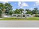 Beautiful single-story home with a well-manicured front yard and mature palm trees at 521 51St S Ave, St Petersburg, FL 33705