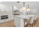Modern kitchen featuring quartz countertops, stainless steel appliances, and custom white cabinetry at 521 51St S Ave, St Petersburg, FL 33705