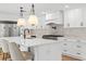 Bright, updated kitchen with white cabinets, stainless steel appliances, and quartz countertops at 521 51St S Ave, St Petersburg, FL 33705