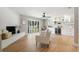 Bright living room boasts a brick fireplace, large window, and a built-in bar with wine fridge at 521 51St S Ave, St Petersburg, FL 33705