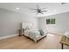 Calming main bedroom with light wood floors, large window, and ample natural light at 521 51St S Ave, St Petersburg, FL 33705