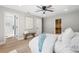 Serene main bedroom with light wood floors, walk-in closet, and a bench at 521 51St S Ave, St Petersburg, FL 33705