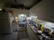 This kitchen features classic white cabinets and appliances, ready for a modern update at 6817 S Wall St, Tampa, FL 33616