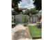 Backyard featuring a shed, some greenery, and an outdoor area with artificial turf at 7022 Hubert, Tampa, FL 33614