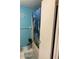 A bathroom with nautical decor including a dolphin shower curtain and a small green plant at 7022 Hubert, Tampa, FL 33614