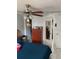Comfortable bedroom featuring closet, dresser, ceiling fan and a view into the closet at 7022 Hubert, Tampa, FL 33614