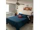 Cozy bedroom features a ceiling fan, comfortable bed, and charming decor at 7022 Hubert, Tampa, FL 33614