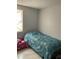 Bright bedroom featuring a bed, window, and a cute pink toy car at 7022 Hubert, Tampa, FL 33614