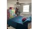 Spacious bedroom with a ceiling fan, window, and charming furniture pieces at 7022 Hubert, Tampa, FL 33614