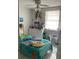 Bright bedroom with a ceiling fan, window, and a bed decorated with playful character-themed linens at 7022 Hubert, Tampa, FL 33614