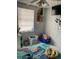 This bedroom is equipped with a ceiling fan and is decorated with playful character-themed linens at 7022 Hubert, Tampa, FL 33614