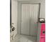 Bedroom closet and dresser and a laptop sitting atop a pink toy kitchen at 7022 Hubert, Tampa, FL 33614