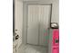 Bedroom closet and dresser and a laptop sitting atop a pink toy kitchen at 7022 Hubert, Tampa, FL 33614
