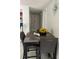 Dining area features a table with seating for four and a view of the hallway at 7022 Hubert, Tampa, FL 33614