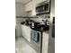 Modern kitchen features stainless steel appliances, subway tile backsplash, and ample counter space at 7022 Hubert, Tampa, FL 33614