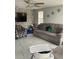 Well-lit living room features comfortable seating and a view of the exterior at 7022 Hubert, Tampa, FL 33614