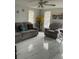 Well-lit living room highlights neutral colors and views to the outdoor at 7022 Hubert, Tampa, FL 33614