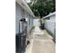 Side yard features a pathway and equipment at 7022 Hubert, Tampa, FL 33614