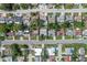 An aerial view of a neighborhood showcasing well-maintained homes, green spaces, and community layout at 7040 Fox Hollow Dr, Port Richey, FL 34668