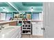 The large bathroom includes dual sinks and storage shelving at 7040 Fox Hollow Dr, Port Richey, FL 34668
