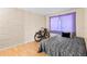 Comfortable bedroom featuring textured walls and a cozy bed at 7040 Fox Hollow Dr, Port Richey, FL 34668