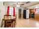 View of the breakfast nook with a round table and kitchen access at 7040 Fox Hollow Dr, Port Richey, FL 34668