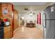 Open dining area with wood floors and bright windows, adjacent to kitchen at 7040 Fox Hollow Dr, Port Richey, FL 34668
