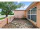 Exterior of the home shows the corner of a tan colored home at 7040 Fox Hollow Dr, Port Richey, FL 34668