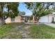 Charming single-story home featuring a front lawn and an attached two-car garage at 7040 Fox Hollow Dr, Port Richey, FL 34668