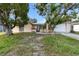 Charming single-story home featuring a front lawn and an attached two-car garage at 7040 Fox Hollow Dr, Port Richey, FL 34668