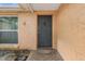 Stylish front door with decorative details and a welcoming entrance at 7040 Fox Hollow Dr, Port Richey, FL 34668