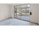 The enclosed patio has access to the backyard through the sliding glass door at 7040 Fox Hollow Dr, Port Richey, FL 34668
