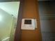Thermostat on the wall, adjacent to the bathroom at 7192 E Bank Dr, Tampa, FL 33617