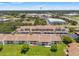 An aerial view shows well-maintained community, green spaces, and convenient parking at 7614 Radcliffe Cir # 202B, Port Richey, FL 34668