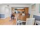 Open dining area with wood floors adjacent to the kitchen at 7614 Radcliffe Cir # 202B, Port Richey, FL 34668