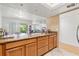 Kitchen with granite countertops, stainless steel appliances, and tiled backsplash at 7614 Radcliffe Cir # 202B, Port Richey, FL 34668