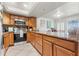 Kitchen with stainless steel appliances and granite countertops at 7614 Radcliffe Cir # 202B, Port Richey, FL 34668
