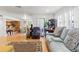 Open-concept layout showcasing the living room and connecting to the kitchen area at 7614 Radcliffe Cir # 202B, Port Richey, FL 34668