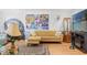 Bright living room with hardwood floors, stylish furniture and an interesting art collection at 7614 Radcliffe Cir # 202B, Port Richey, FL 34668