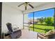 Relaxing screened-in porch overlooking green lawn, perfect for enjoying the outdoors in comfort at 7614 Radcliffe Cir # 202B, Port Richey, FL 34668