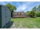 A spacious backyard featuring a wooden deck and shed, perfect for outdoor enjoyment at 811 W Peninsular St, Tampa, FL 33603