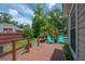 Outdoor wooden deck surrounded by trees and greenery at 811 W Peninsular St, Tampa, FL 33603